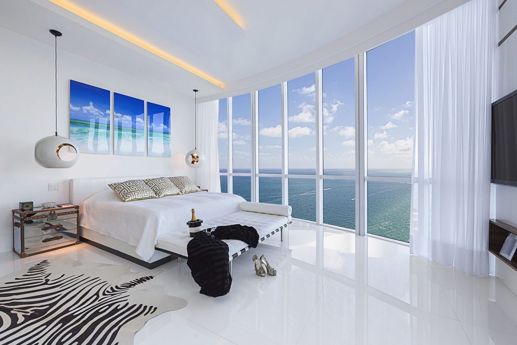 Incredible Designer bedroom with white floor next to Ocean. Cont